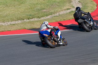 Illustration for article titled What Is Trail Braking, and How It'll Make You a Better Rider and Driver